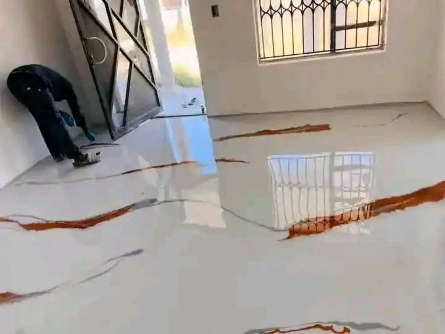 Glossy white epoxy floor with decorative finish